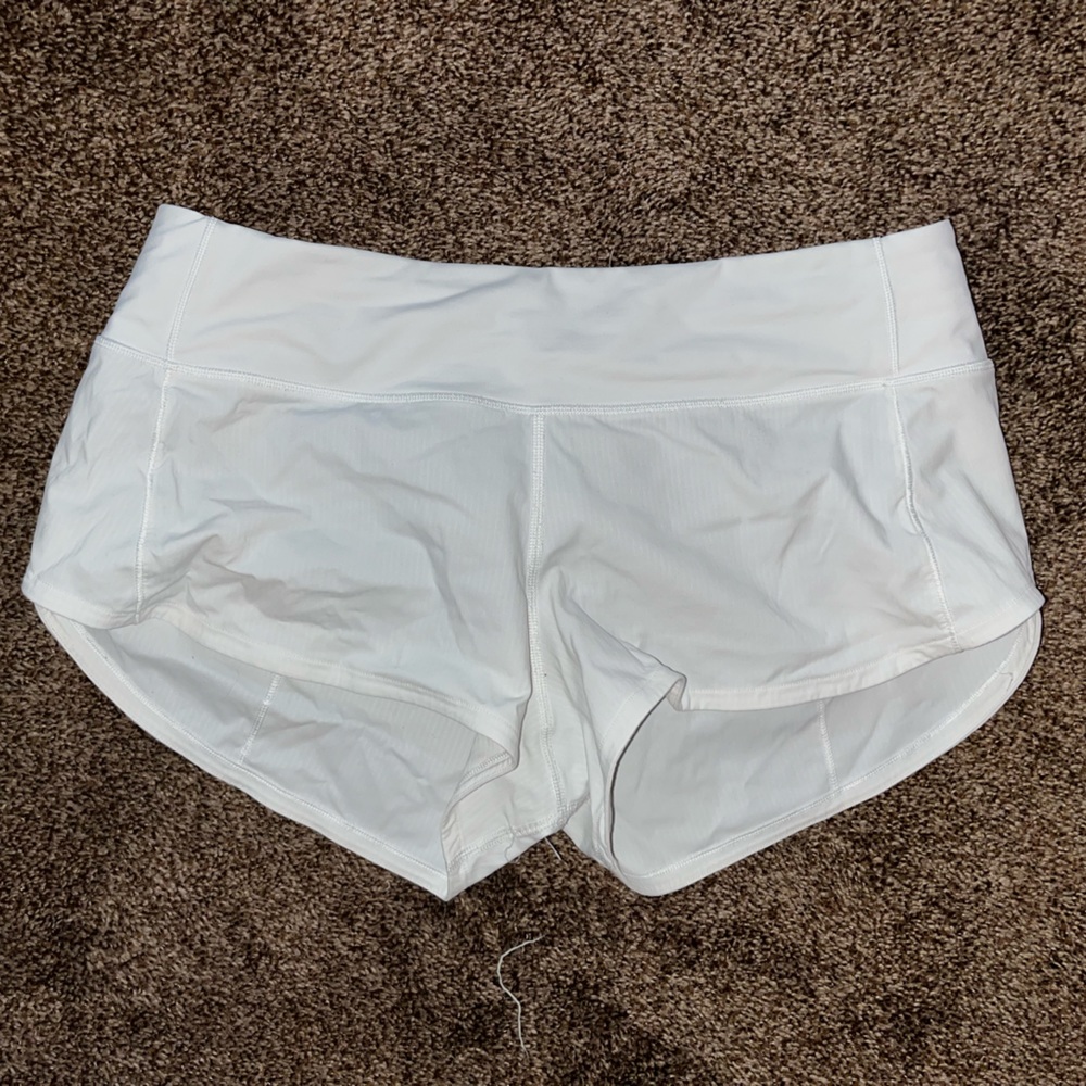 White Lululemon Speed Up running shorts.